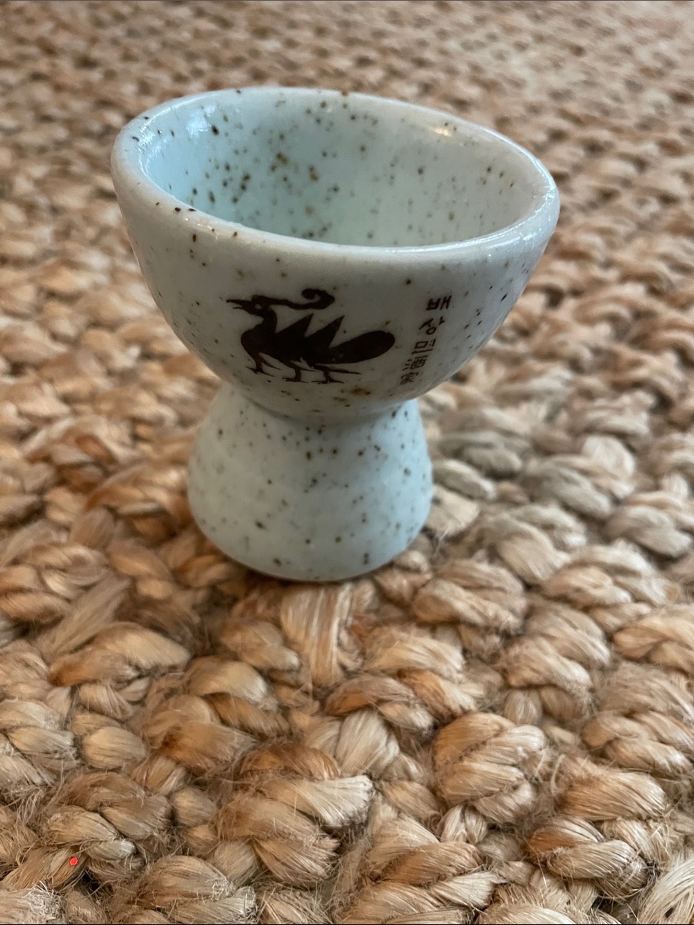 Speckled White Ceramic Egg Cup with Crane Illustration